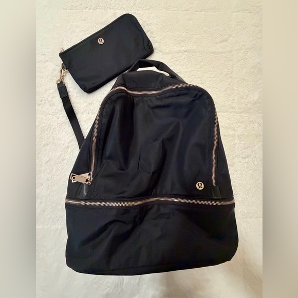 lululemon athletica Handbags - lululemon athletica Black Backpack and wristlet.